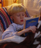 boy reading on couch